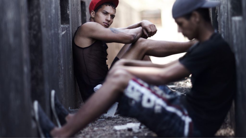 Contextual safeguarding, image of two teens sat in alleyway.