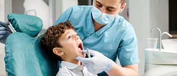 Dentist looking at a child's teeth