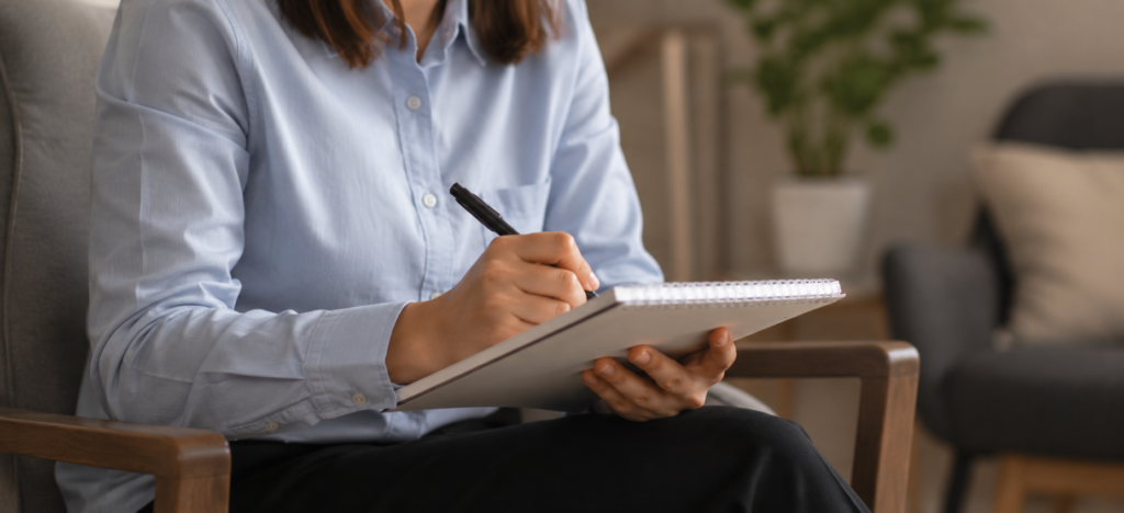 A safeguarding supervisor taking notes during a session