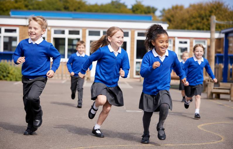 Children playing safely in a playground while section 175 is adheared to.