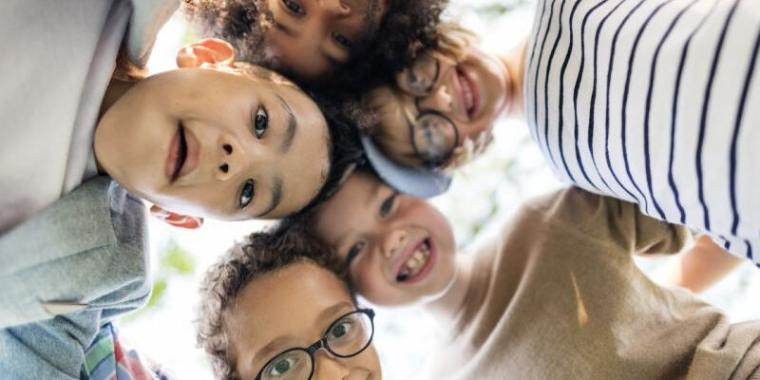Diverse group of children playing and smiling together