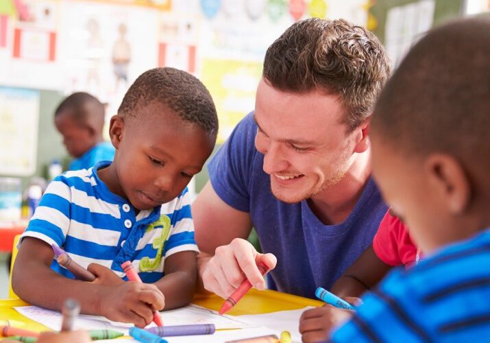 early years teaching drawing with a student